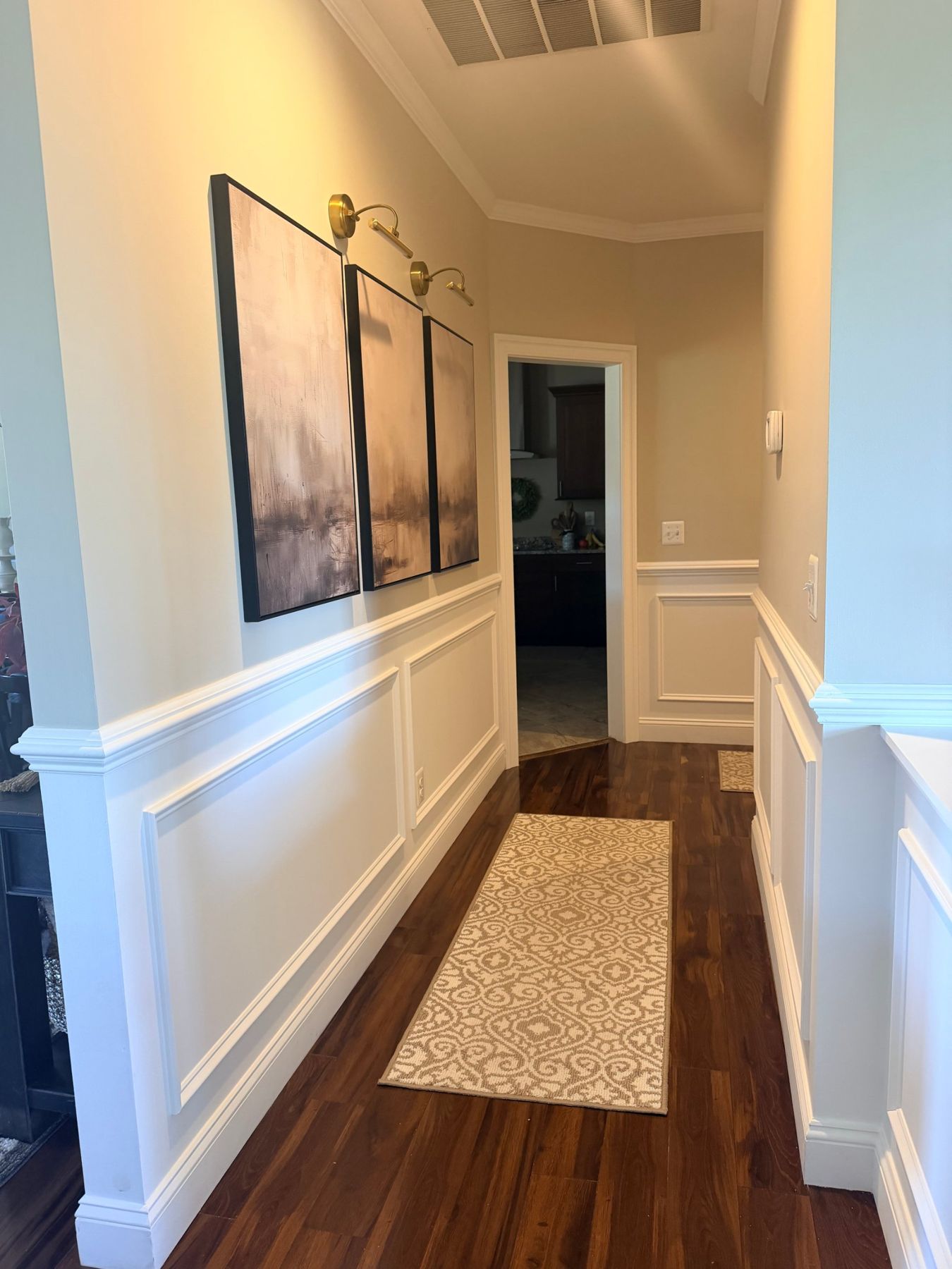 Hallway with picture-frame wainscoting and chair rail